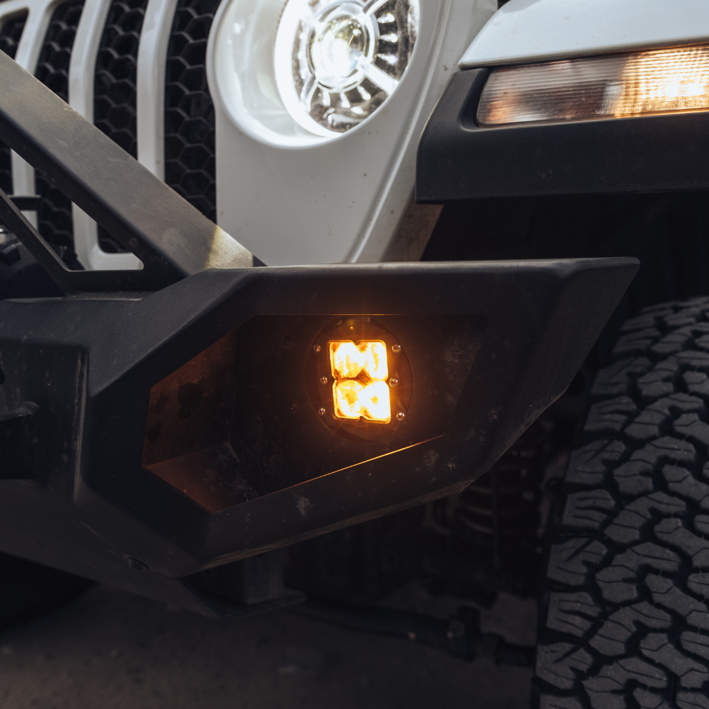 heretic quattro led fog light kit for jeep rubicon in mounted on a jeep